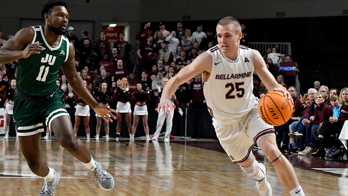 Bellarmine guard CJ Fleming (25) drives past Jacksonville guard Jordan Davis (11) during the second half of an NCAA college basketball for the championship game at the Atlantic Sun Conference men's tournament in Louisville, Kentucky, Tuesday, March 8, 2022.