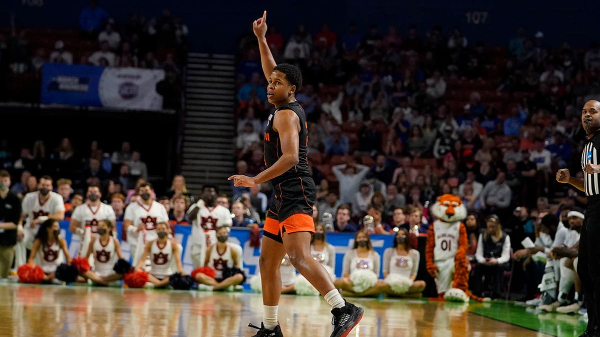 Miami guard Charlie Moore (3) celebrates after scoring during the second half of a college basketball game against Auburn in the second round of the NCAA tournament Sunday, March 20, 2022, in Greenville, S.C. 