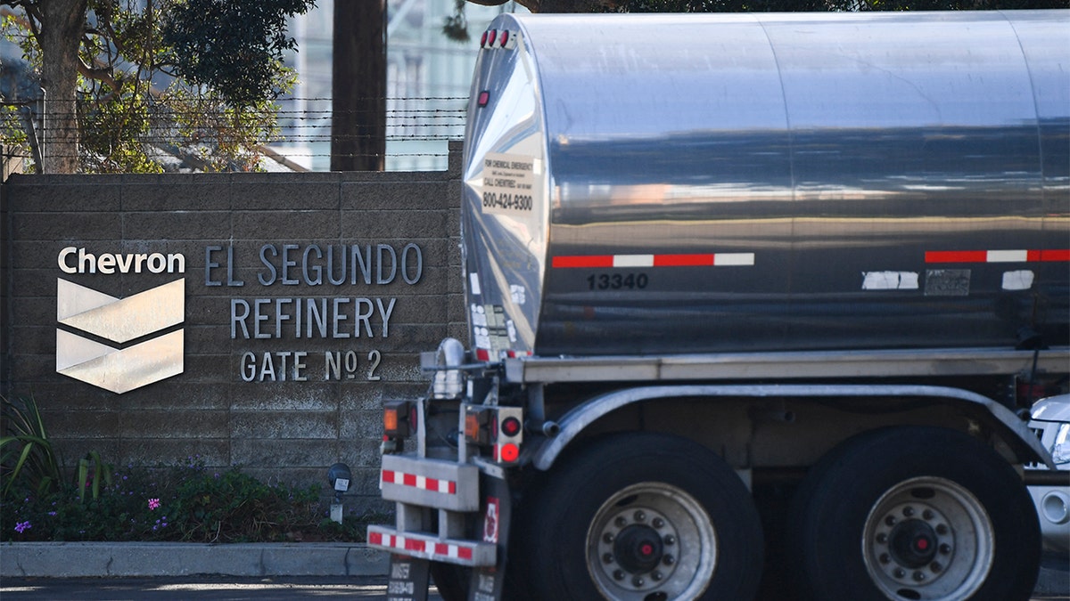 The Chevron logo is displayed as a tanker truck enters the Chevron Products Company El Segundo Refinery on Jan. 26, 2022, in El Segundo, California. (Photo by PATRICK T. FALLON/AFP via Getty Images)