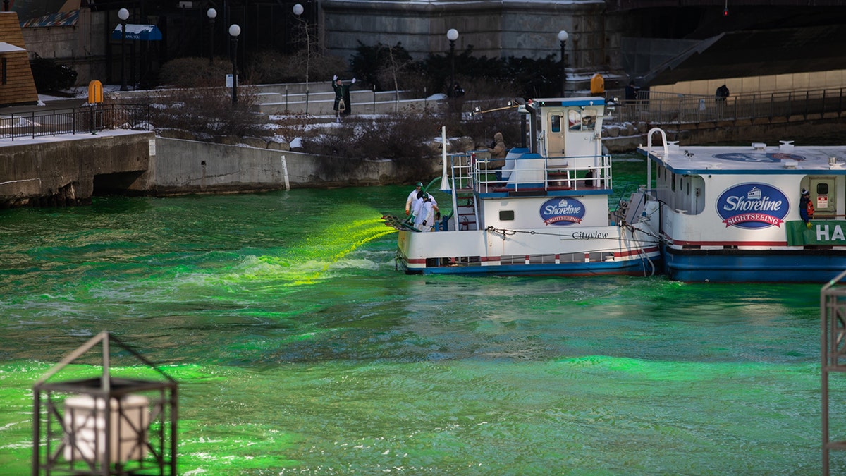 Workers on a barge dyed the Chicago River green ahead of St. Patrick's Day.