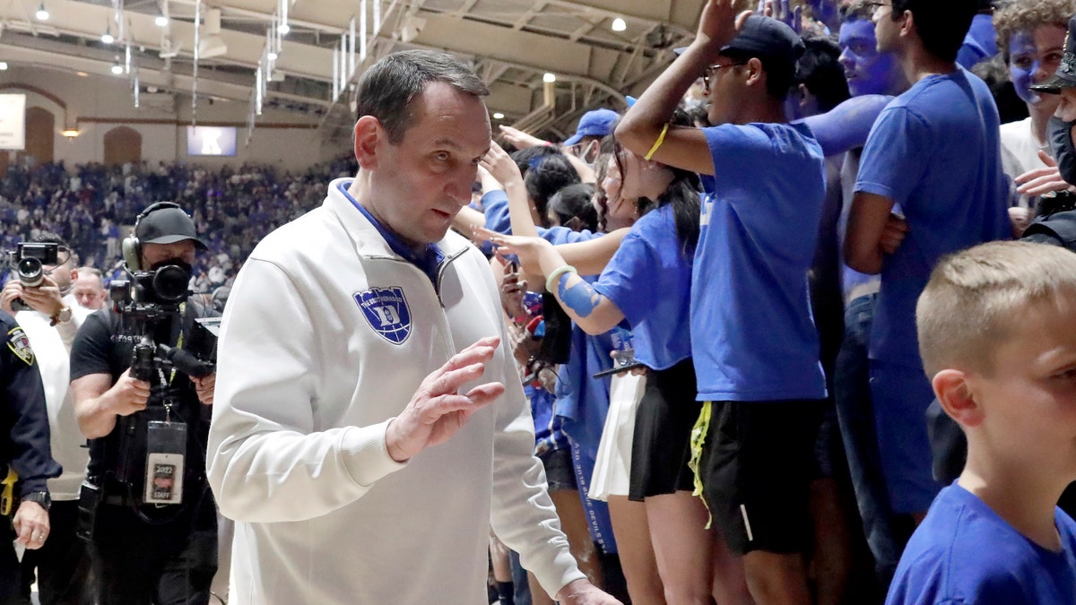 Duke coach Mike Krzyzewski walks off the floor following a tribute in his honor after the team's NCAA college basketball game against North Carolina, Saturday, March 5, 2022, in Durham, N.C. Krzyzewski, who is retiring after the season, coached his final game at Cameron Indoor Stadium.?