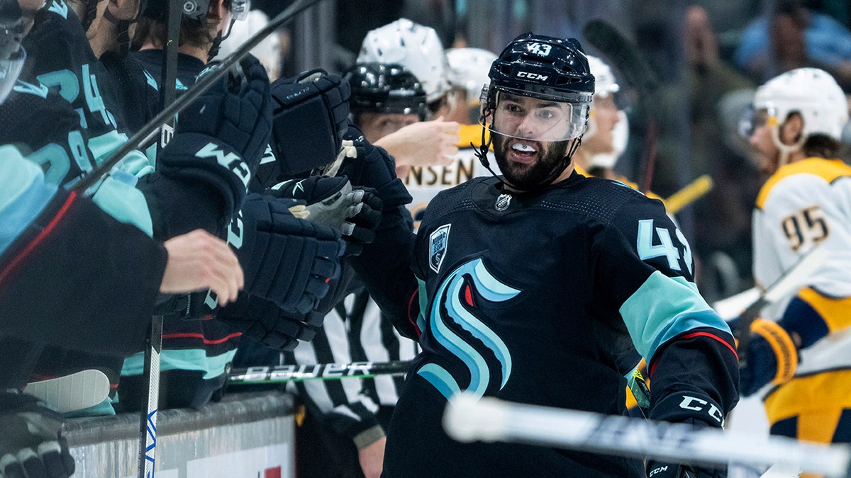 Seattle Kraken forward Colin Blackwell is congratulated by teammates after scoring a shorthanded goal during the third period of the team's NHL hockey game against the Nashville Predators, Wednesday, March 2, 2022, in Seattle. The Kraken won 4-3.
