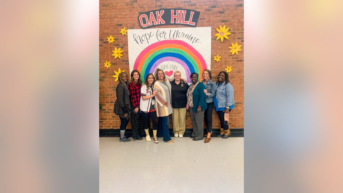 Lana Gazhenko (center) is surrounded by her colleagues from Oak Hill Elementary School in Covington, Georgia.