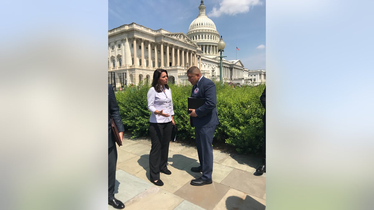 Torres, seen here with former Rep. Tulsi Gabbard at a 2018 news conference on Capitol Hill, has also been lobbying for veterans who were denied care by the VA for their burn pit exposure.