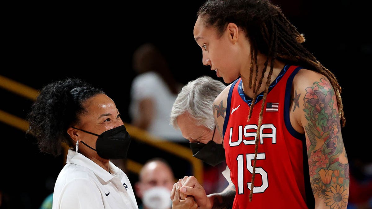 SAITAMA, JAPAN - AUGUST 04: Brittney Griner #15 and head coach Dawn Staley of Team United States celebrate a win against Team Australia during the second half of a Women's Basketball Quarterfinals game on day twelve of the Tokyo 2020 Olympic Games at Saitama Super Arena on August 04, 2021 in Saitama, Japan.