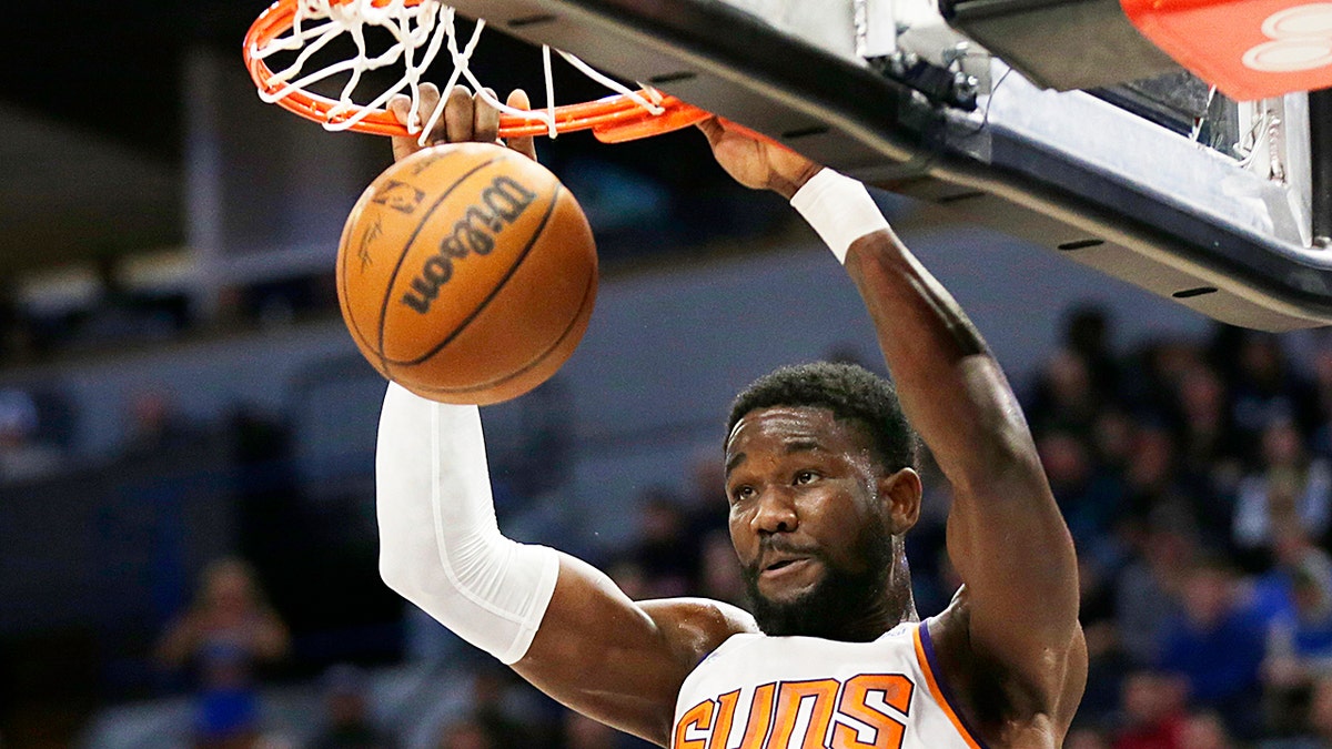 Phoenix Suns center Deandre Ayton dunks against the Minnesota Timberwolves during the second half of an NBA basketball game Wednesday, March 23, 2022, in Minneapolis.