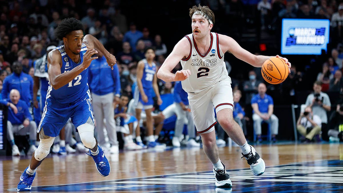 Gonzaga forward Drew Timme (2) drives past Memphis forward DeAndre Williams (12) during the second half of a second-round NCAA college basketball tournament game, Saturday, March 19, 2022, in Portland, Ore.