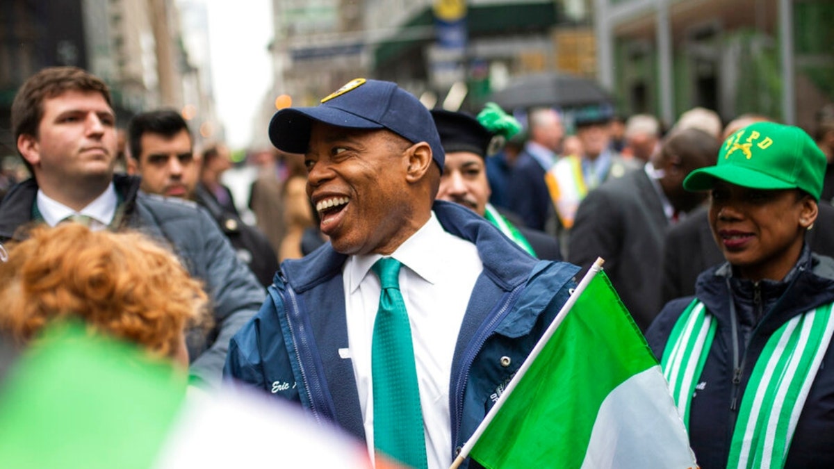 New York Mayor Eric Adams, center smiles as he marches up Fifth Avenue during the St. Patrick's Day Parade, Thursday, March 17, 2022, in New York. 