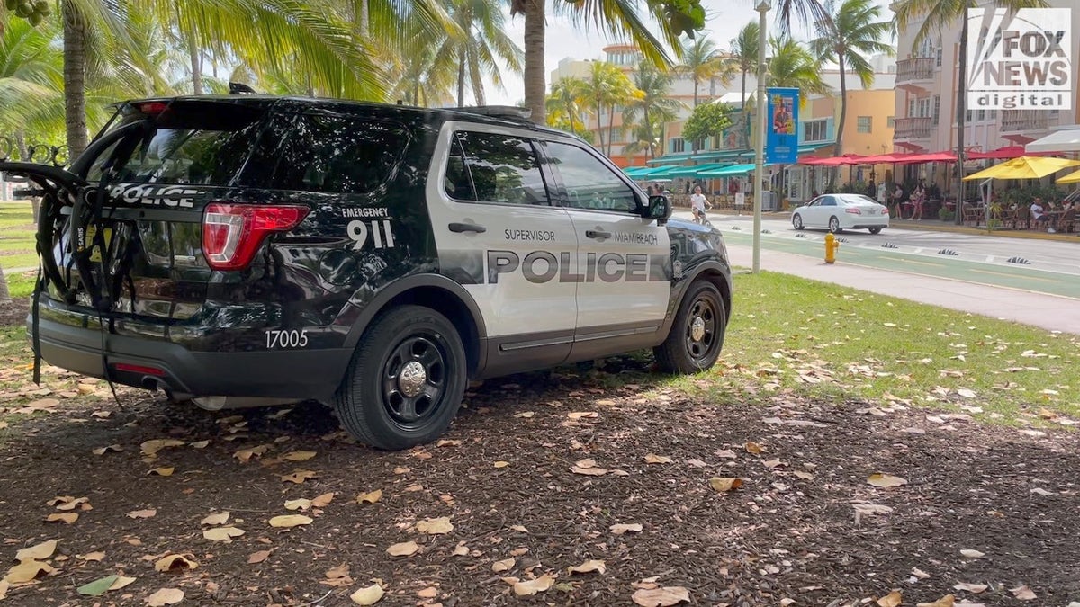 Police car monitoring Ocean Drive on Miami Beach.