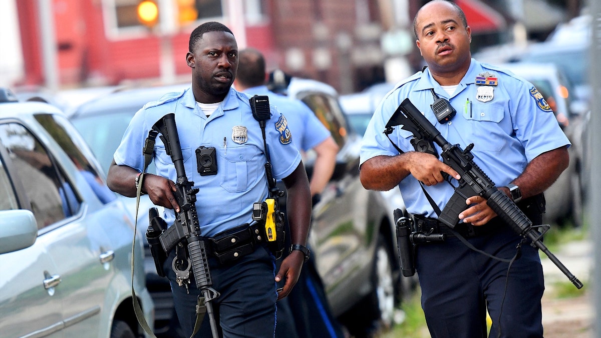 Police officers carrying assault rifles respond to a shooting on August 14, 2019 in Philadelphia, Pennsylvania. (Photo by Mark Makela/Getty Images)