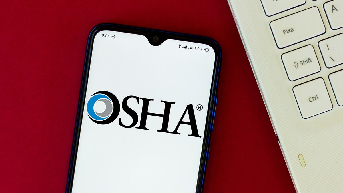 The Occupational Safety and Health Administration (OSHA) logo seen displayed on a smartphone in an illustration on Aug. 24, 2020. 