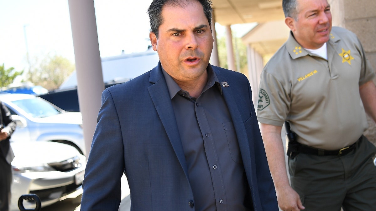 Rep. Mike Garcia, left, and L.A. County Sheriff Alex Villanueva prior to a press conference on illegal marijuana grows in the Antelope Valley outside the Los Angeles County Farm Bureau in Palmdale. (Wally Skalij / Los Angeles Times via Getty Images)