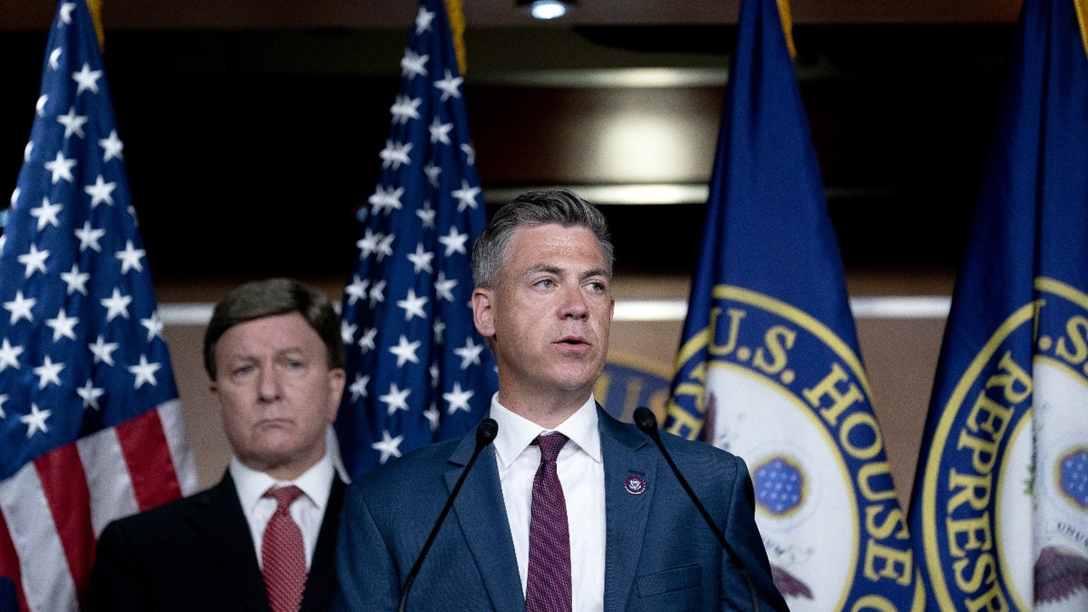 Representative Jim Banks, a Republican from Indiana, right, speaks during a news conference following an all member House briefing on Afghanistan at the U.S. Capitol in Washington, D.C., U.S., on Tuesday, Aug. 24, 2021. House Speaker Pelosi and a group of centrist Democrats will resume talks today on how to advance President Biden's legislative agenda, after hours of negotiations failed to break a stalemate. Photographer: Stefani Reynolds/Bloomberg