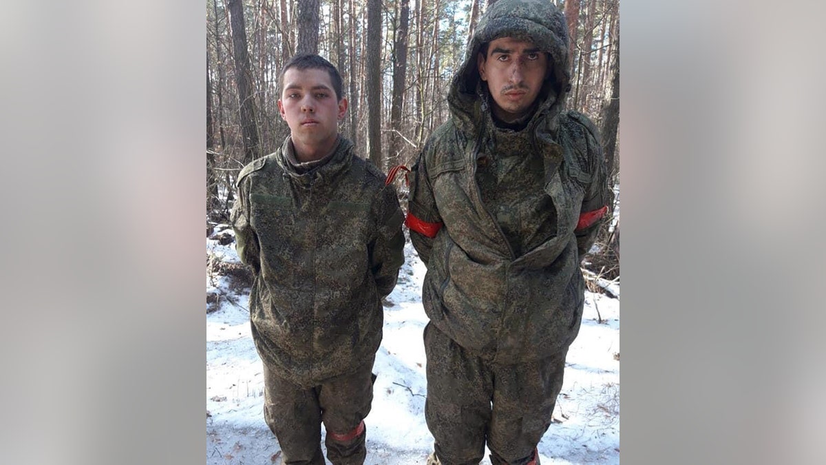 Two Russian soldiers taken prisoner near Kyiv, by Ukraine following Russia's military operation in Ukraine on Feb. 24, 2022.