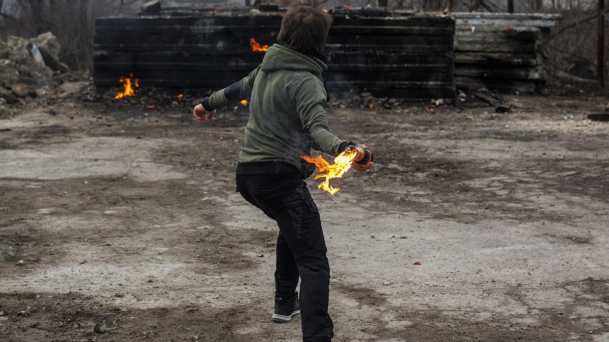 Civilians make Molotov cocktails and training amid Russian attacks in Lviv, Ukraine on March 8, 2022. 