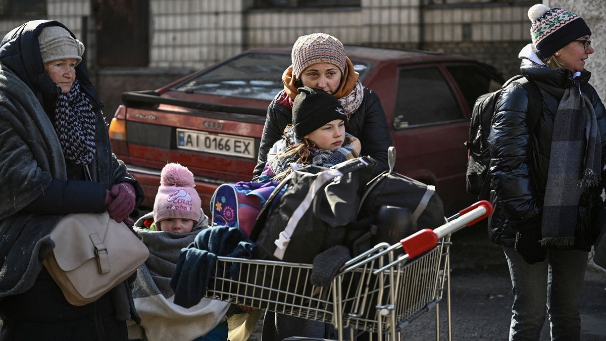 Residents wait to be evacuated from the city of Irpin, north of Kyiv, on March 10, 2022. 