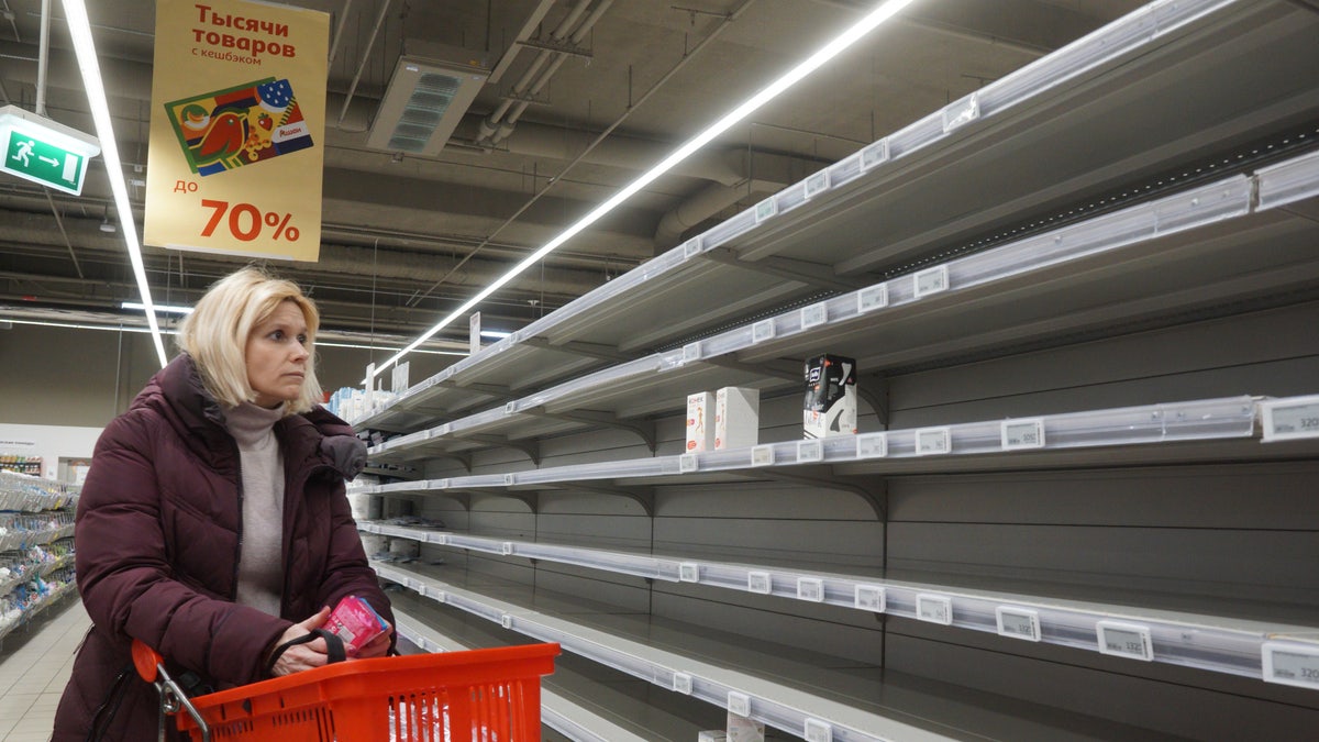 MOSCOW, RUSSIA - MARCH 16 (RUSSIA OUT): A woman looks at empty shelves in the sanitary napkin section at a shopping mall on March 16, 2022, in Moscow, Russia. Many worldwide brands have suspended any investment and sales in Russia over its military invasion on Ukraine. 