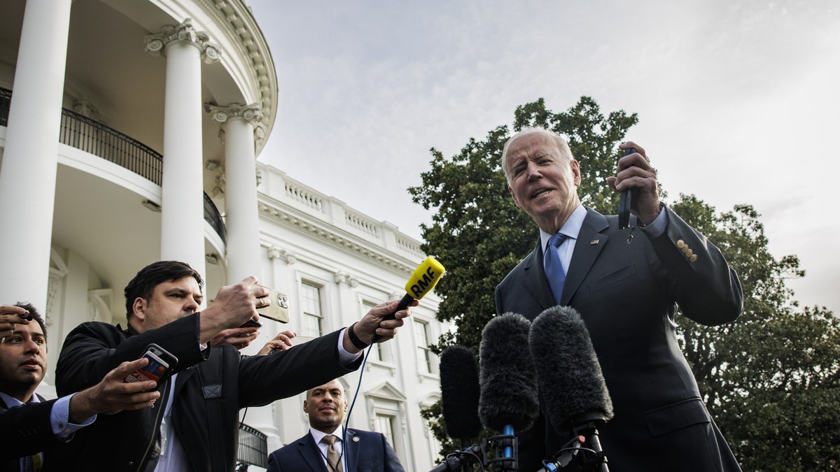 President Joe Biden speaks to members of the media on the South Lawn of the White House before boarding Marine One on March 23, 2022.
