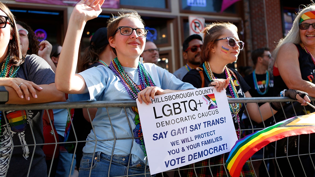 Revelers celebrate on 7th Avenue during the Tampa Pride Parade in the Ybor City neighborhood