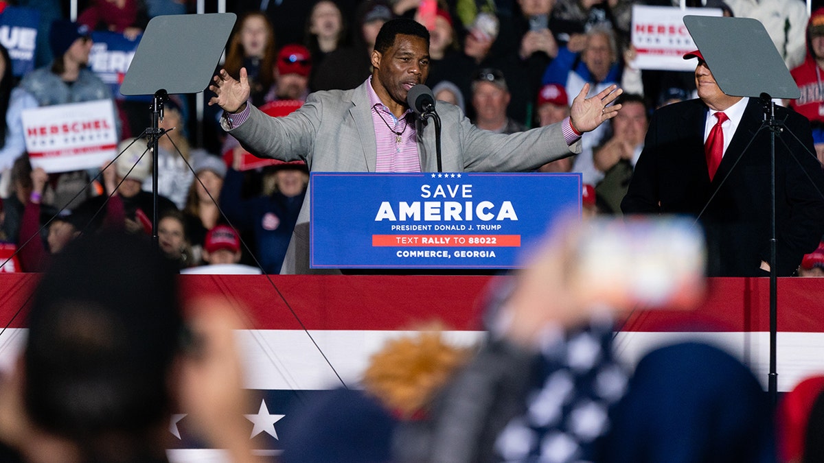 Herschel Walker, Republican senate candidate for Georgia, speaks after being brought on stage by former U.S. President Donald Trump at a "Save America" rally.