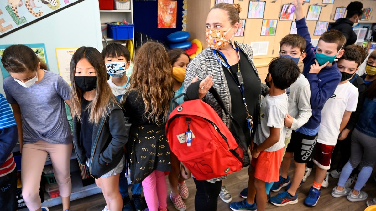 Third grade students in Mrs. Jordan"u2019s class prepare to exit their classroom in orderly fashion as they participate in the Great Shakeout at Pacific Elementary School in Manhattan Beach on Thursday, October 21, 2021. (Photo by Brittany Murray/MediaNews Group/Long Beach Press-Telegram via Getty Images)