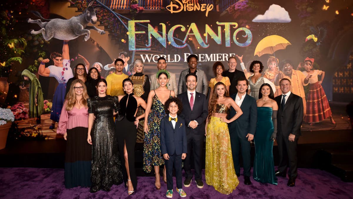 (L-R) Walt Disney Animation Studios CCO & executive producer Jennifer Lee, producer Yvett Merino, composer Germaine Franco, Angie Cepeda, Rhenzy Feliz, Jessica Darrow, María Cecilia Botero, Wilmer Valderrama, Stephanie Beatriz, Ravi Cabot-Conyers, co-writer and songwriter Lin-Manuel Miranda, Mauro Castillo, Carolina Gaitán, Adassa, co-director and screenwriter Jared Bush, John Leguizamo, co-director and screenwriter Charise Castro Smith, Diane Guerrero, and producer Clark Spencer attends the world premiere of Walt Disney Animation Studios' Encanto at El Capitan Theatre in Hollywood, California on November 03, 2021.