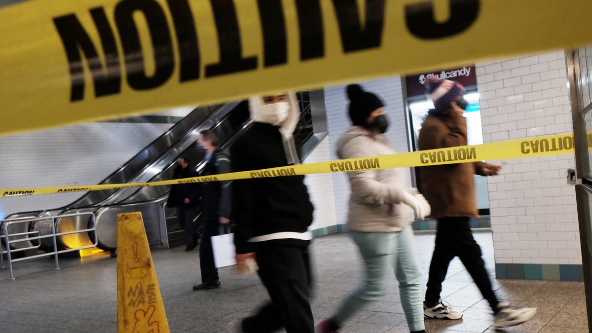 People walk through a subway station in Manhattan on January 19, 2022, in New York City.