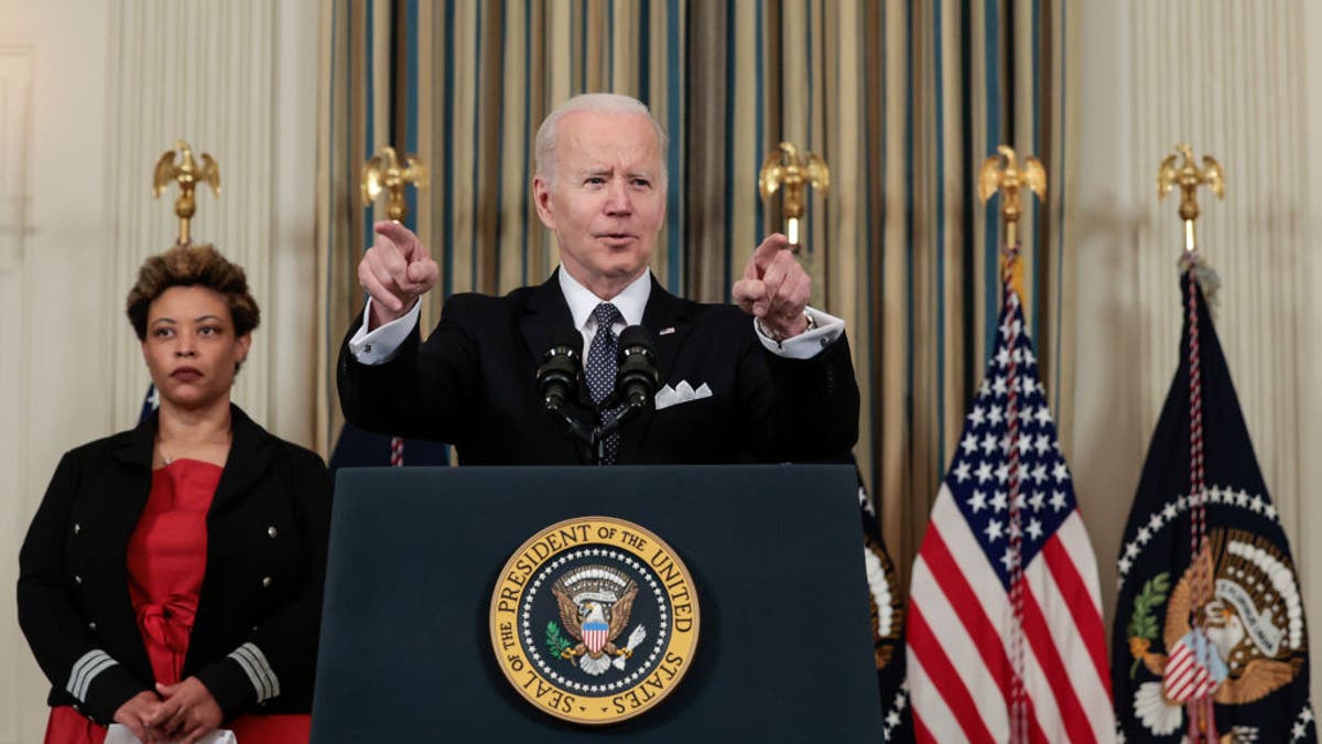 President Joe Biden speaks alongside Director of the Office of Management and Budget Shalanda Young as he introduces his budget request for fiscal year 2023 in the State Dining Room of the White House on March 28, 202, ?in Washington, D.C.