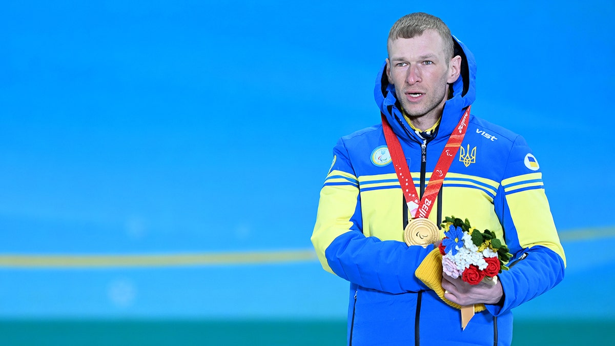 Gold medalist Grygorii Vovchynskyi of Team Ukraine poses during the Para Biathlon Men's Sprint Standing medal ceremony on day two of the Beijing 2022 Winter Paralympics at Zhangjiakou Medals Plaza on March 6, 2022, in Zhangjiakou, Hebei Province of China.