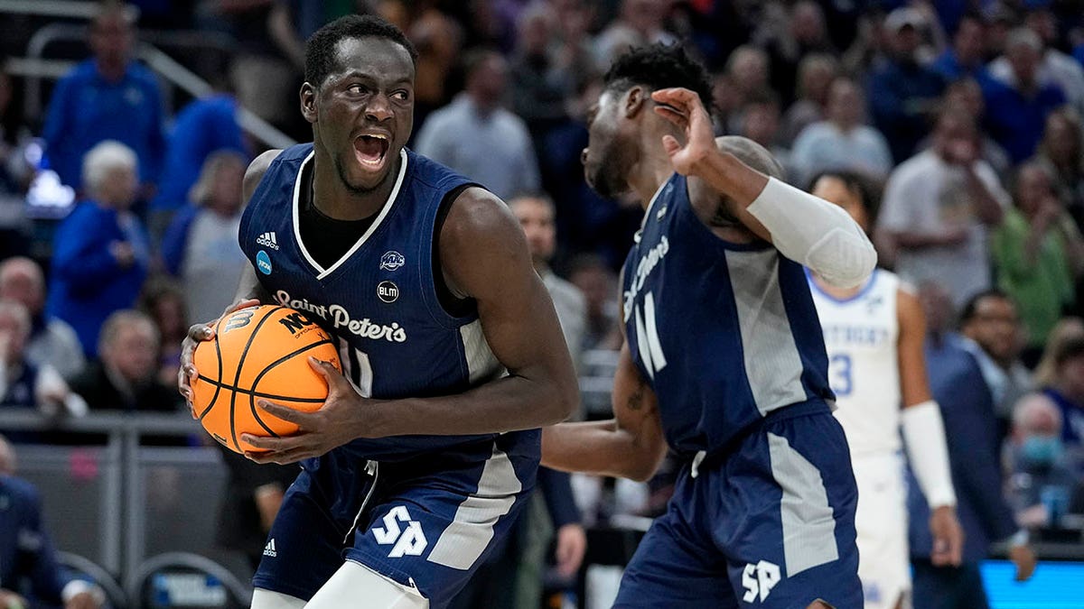 Saint Peter's forward Hassan Drame celebrates after grabbing a rebound during overtime in a college basketball game against Kentucky in the first round of the NCAA tournament, Thursday, March 17, 2022, in Indianapolis. Saint Peter's won 85-79.