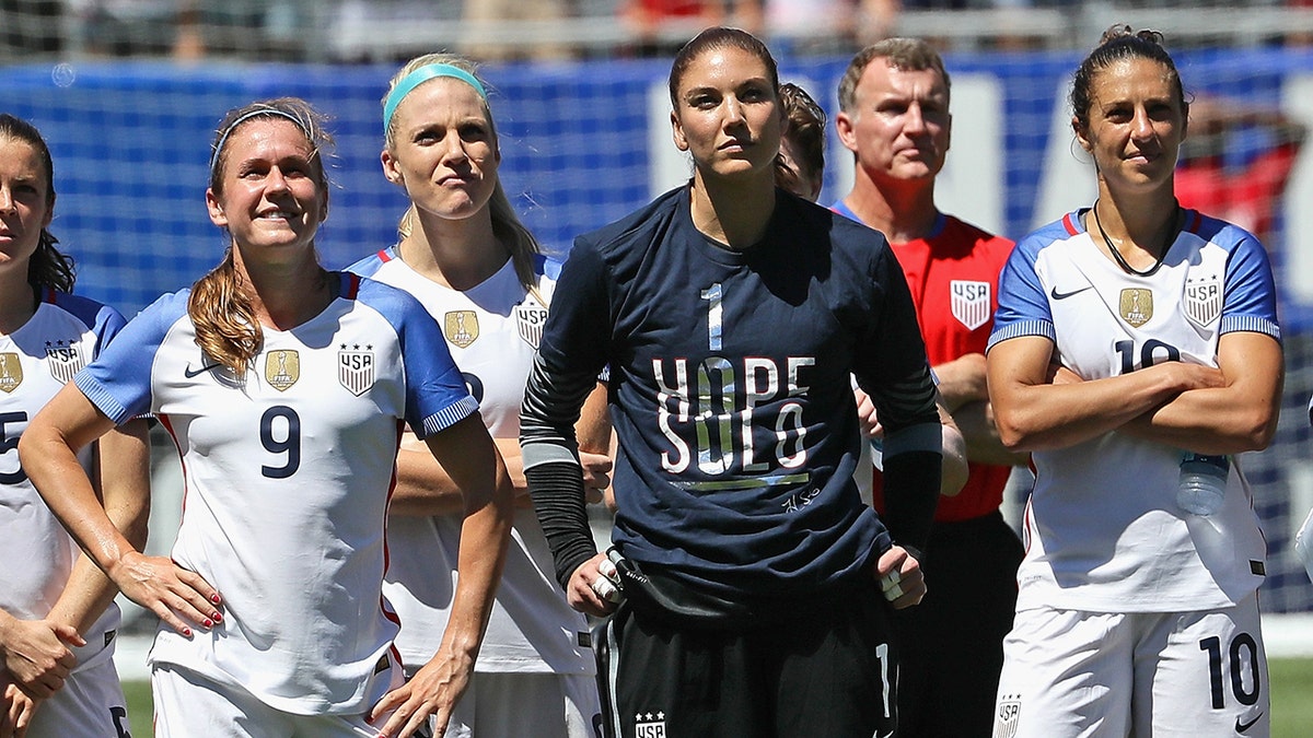 Heather O'Reilly #9, Julie Johnson #8, Hope Solo #1 and Carli Lloyd #10 of the United States 