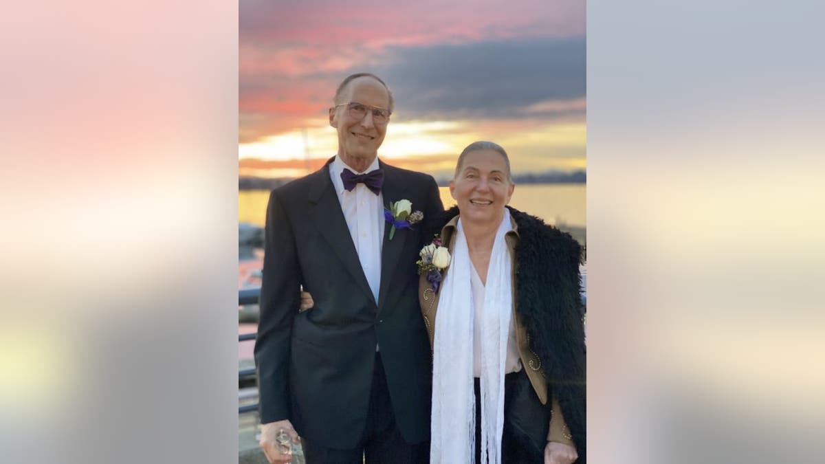 Michael and Colleen Gilbert of Bellevue, Washington, are the parents of six adult children. The pair stopped to take a sunset portrait at Carillion Point after the wedding dress parties.