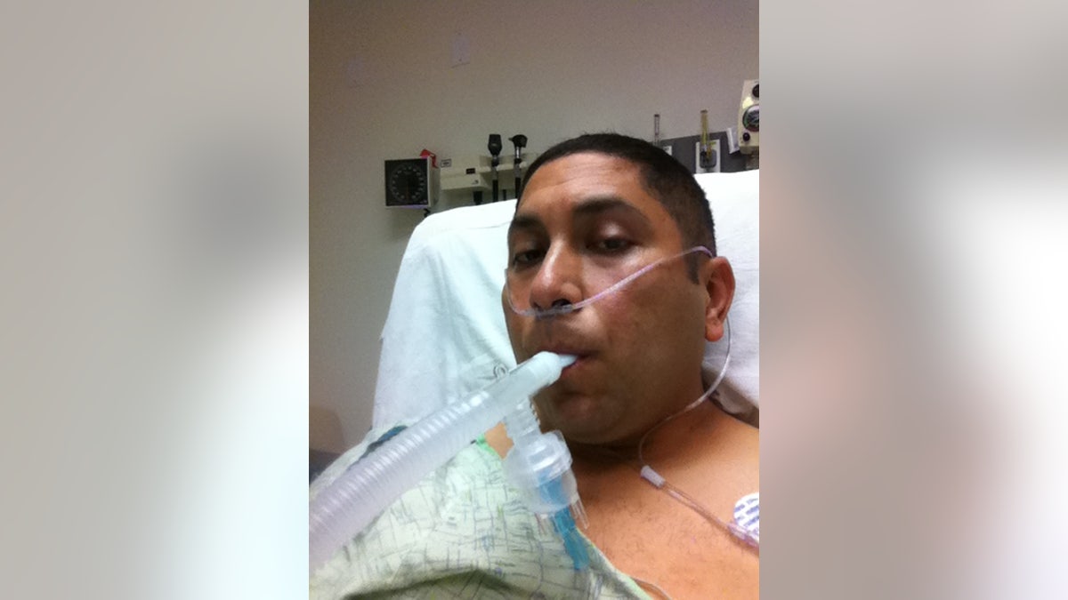 Former Texas state trooper and veteran Le Roy Torres in a hospital bed