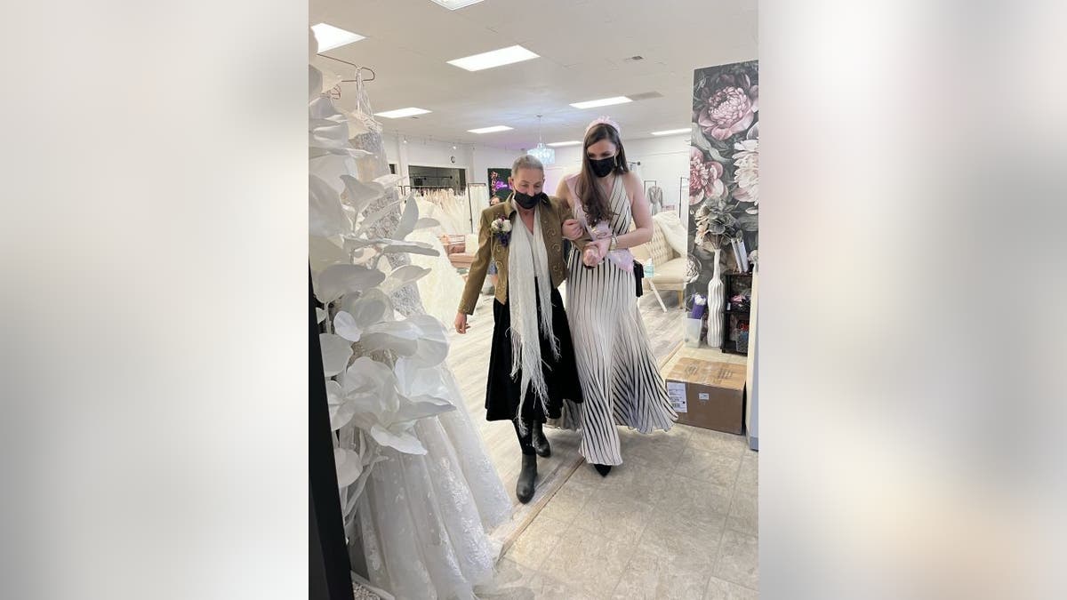 Christine Gilbert (right) surprised her mother, Colleen Gilbert (left), with a trip to a bridal salon so that she could see her daughter try on wedding dresses — even though the daughter is not yet getting married.