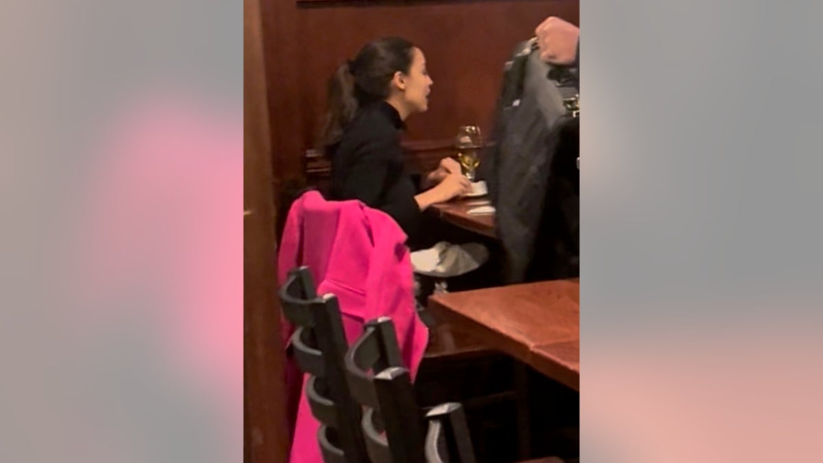 Rep. Alexandria Ocasio-Cortez sits down to dinner with her colleague Rep. Mondaire Jones at Bullfeathers.