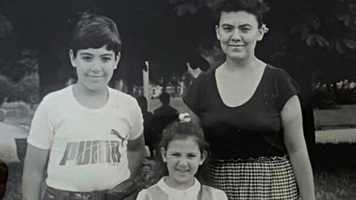 Stella Binkenvich (middle), her brother (left) and her mother (right) in Donetsk