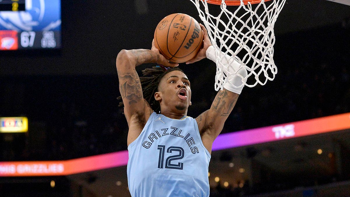 Memphis Grizzlies guard Ja Morant goes up for a dunk during the second half of the team's NBA basketball game against the New Orleans Pelicans on Tuesday, March 8, 2022, in Memphis, Tenn.