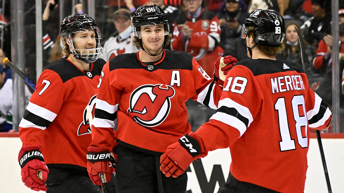 Devils' Jack Hughes gets 1st NHL goal with brother, family watching - ESPN