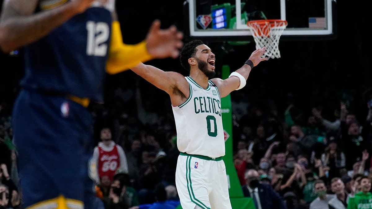 Boston Celtics forward Jayson Tatum (0) celebrates during the final minute of the second half of an NBA basketball game against the Memphis Grizzlies, Thursday, March 3, 2022 in Boston. Tatum scored 37 points as the Celtics defeated the Grizzlies 120-107.