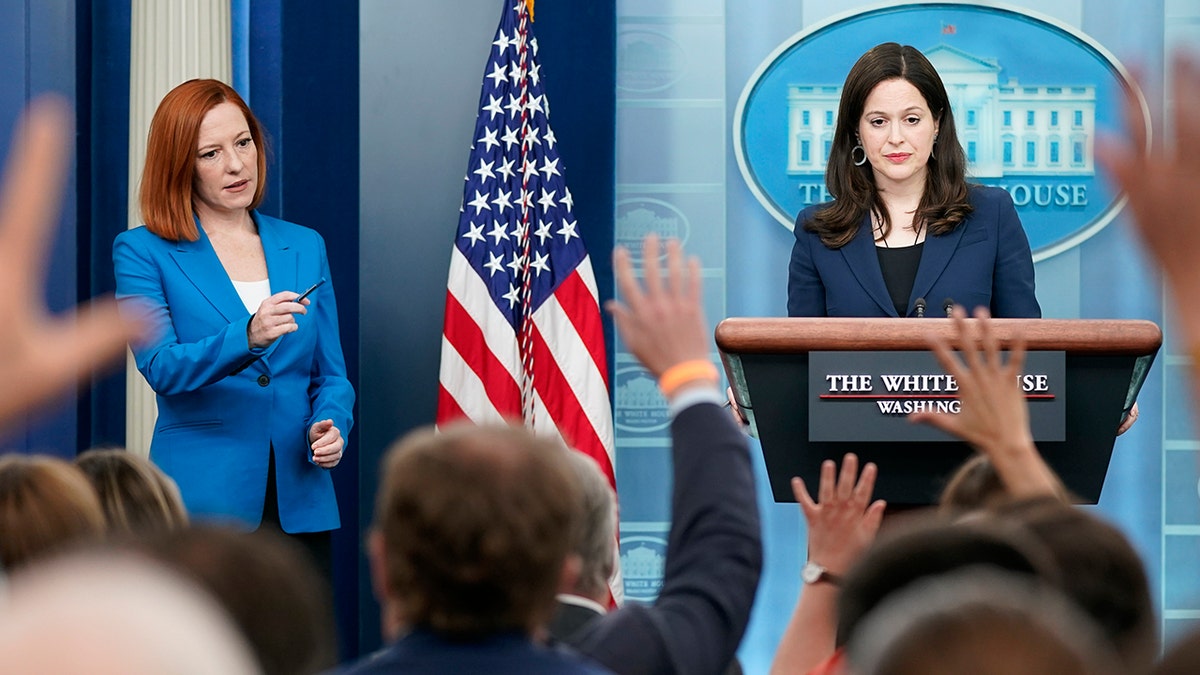 White House press secretary Jen Psaki, left, calls on a reporter as Anne Neuberger, Deputy National Security Advisor for Cyber and Emerging Technology, takes questions during a press briefing at the White House, Monday, March 21, 2022, in Washington. (AP Photo/Patrick Semansky)