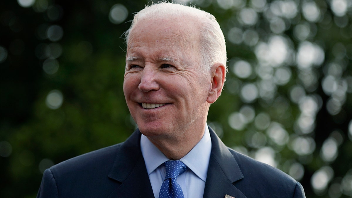 President Biden speaks with members of the press before boarding Marine One on the South Lawn of the White House, Wednesday, March 23, 2022, in Washington. (AP Photo/Patrick Semansky)