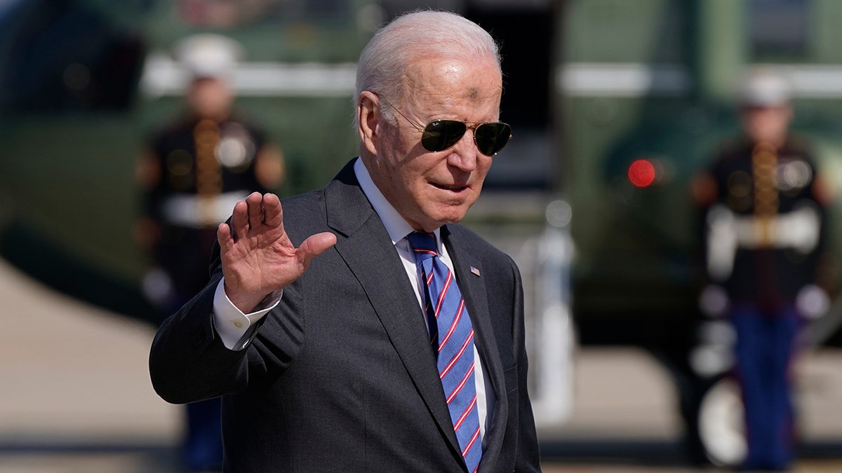 President Biden waves as he and first lady Jill Biden board Air Force One, Wednesday, March 2, 2022, at Andrews Air Force Base, Md. (AP Photo/Patrick Semansky)