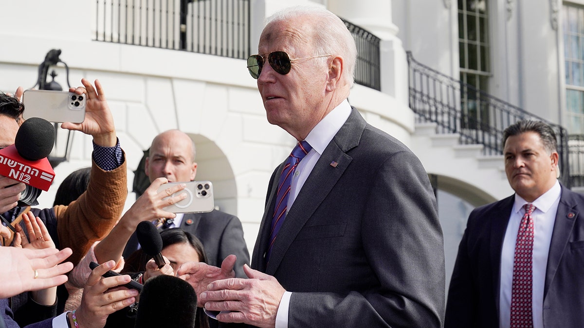 President Biden talks to the media before boarding Marine One on the South Lawn of the White House, March 2, 2022.