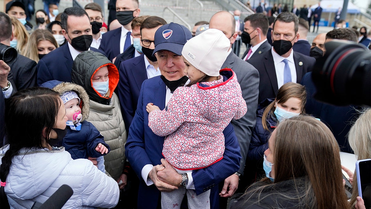 President Biden meets with Ukrainian refugees and humanitarian aid workers during a visit to PGE Narodowy Stadium, Saturday, March 26, 2022, in Warsaw. (AP Photo/Evan Vucci)