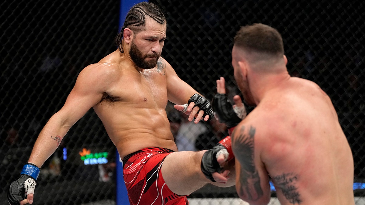 Jorge Masvidal kicks Colby Covington in their welterweight fight during the UFC 272 event on March 5, 2022, in Las Vegas, Nevada.