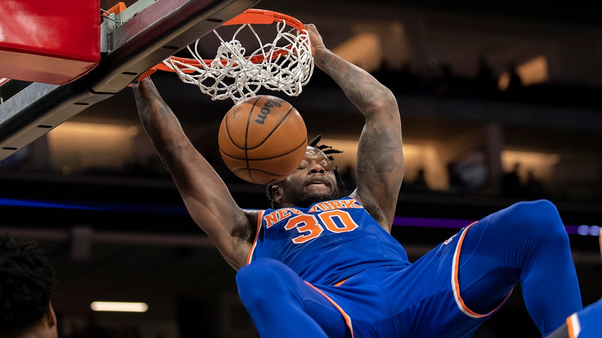 New York Knicks forward Julius Randle (30) scores in the first quarter of an NBA basketball game against the Sacramento Kings in Sacramento, Calif., Monday, March 7, 2022. 