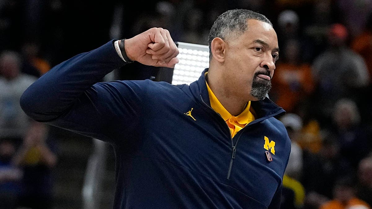 Michigan head coach Juwan Howard reacts after his team defeated Tennessee in a college basketball game in the second round of the NCAA tournament, Saturday, March 19, 2022, in Indianapolis.