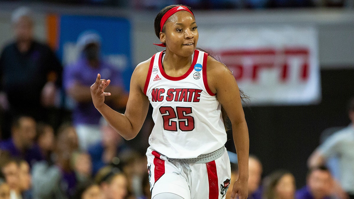 North Carolina State's Kayla Jones (25) reacts after a 3-point basket during the first half of a college basketball game against Kansas State in the second round of the NCAA tournament in Raleigh, N.C., Monday, March 21, 2022.