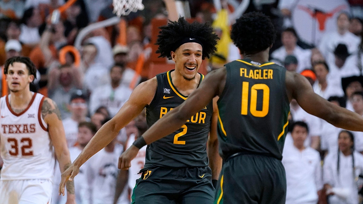 Baylor guard Kendall Brown (2) and teammate Adam Flagler (10) celebrate a score during the second half of the team's NCAA college basketball game against Texas, Monday, Feb. 28, 2022, in Austin, Texas.