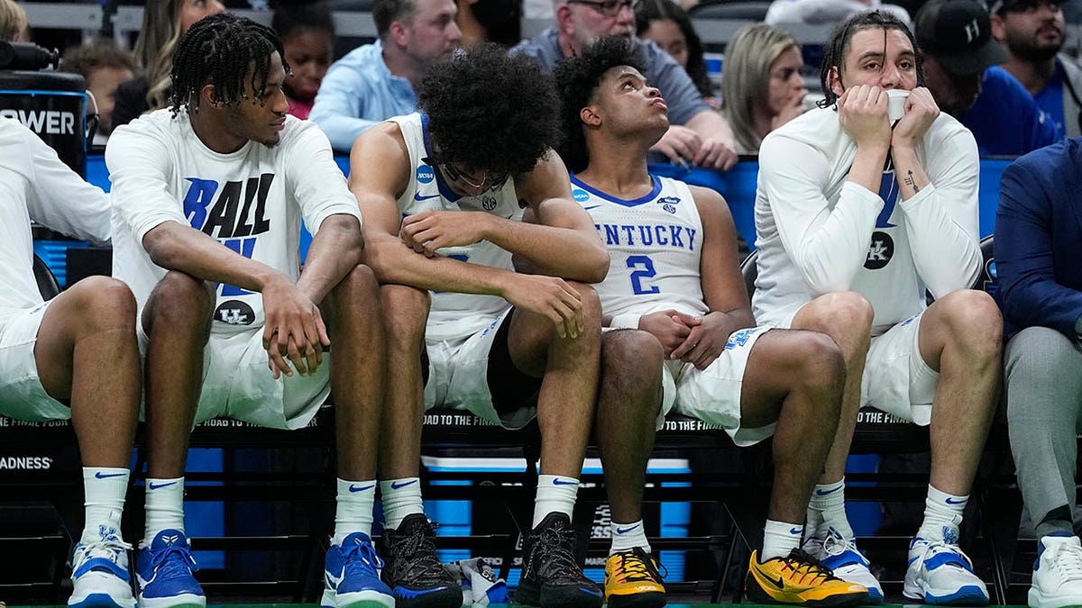 Kentucky players react on the bench at the end of a college basketball game against Saint Peter's in the first round of the NCAA tournament, Thursday, March 17, 2022, in Indianapolis. Saint Peter's won 85-79 in overtime.